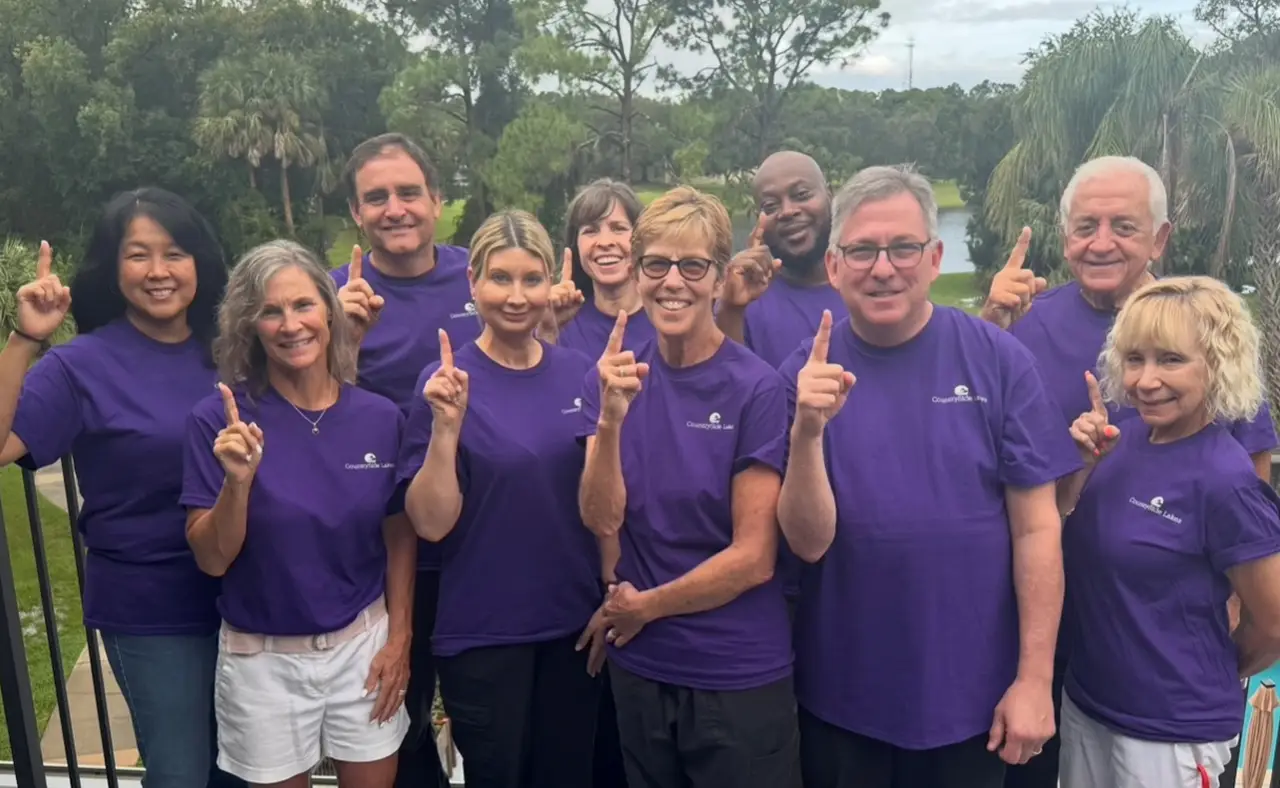 Frontier Senior Living team members celebrating together outdoors